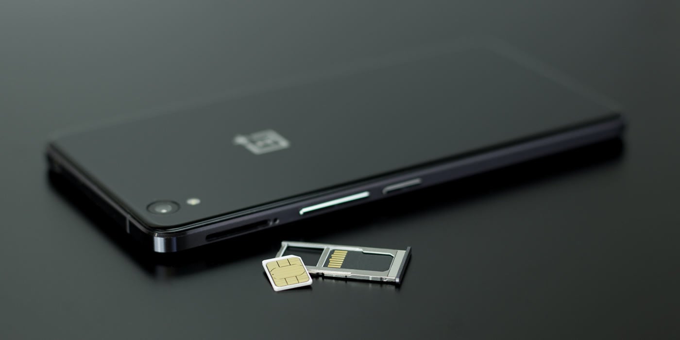Black phone next to sim card